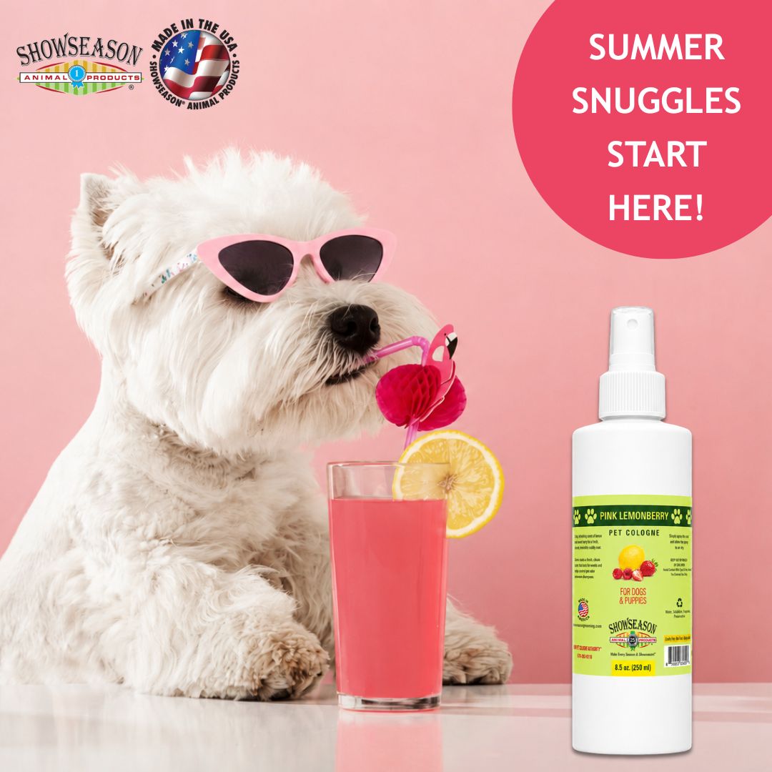 Dog wearing sunglasses drinking pink lemonade beside a bottle of Showseason® Pink Lemonberry Pet Cologne on a soft pink background with “Summer Snuggles Start Here!” text and Showseason® Animal Products branding